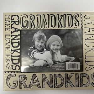 5 x 7 grandkids picture frame beige with black writing gently used.